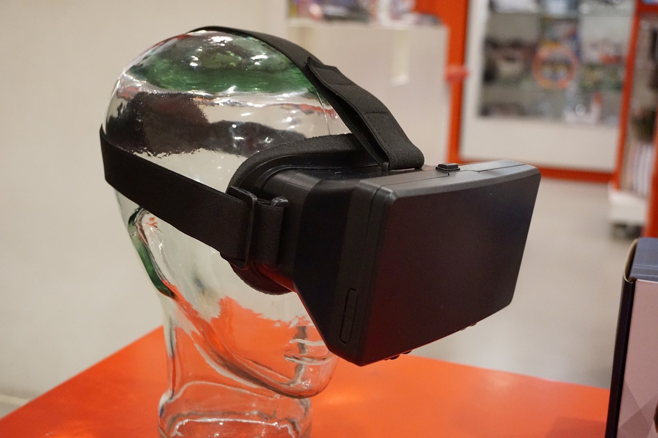 A player leaning back in a headset as a virtual scene tips around him.