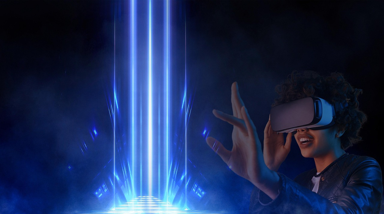 A woman grinning inside a VR headset mid-ride.